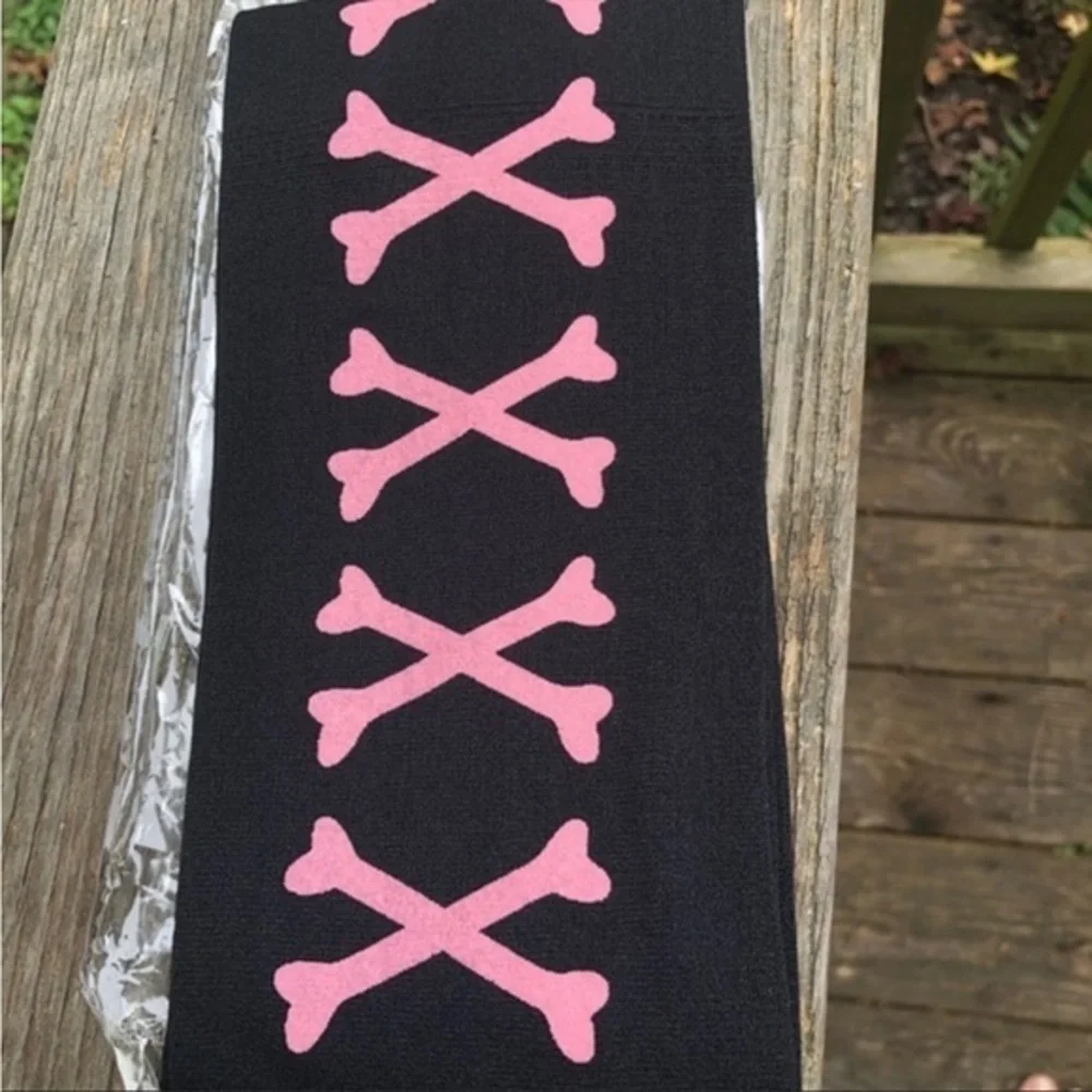 Over the knee socks with cross bones